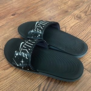 NIKE slides Black with white stars. Size 5Y. Preowned.